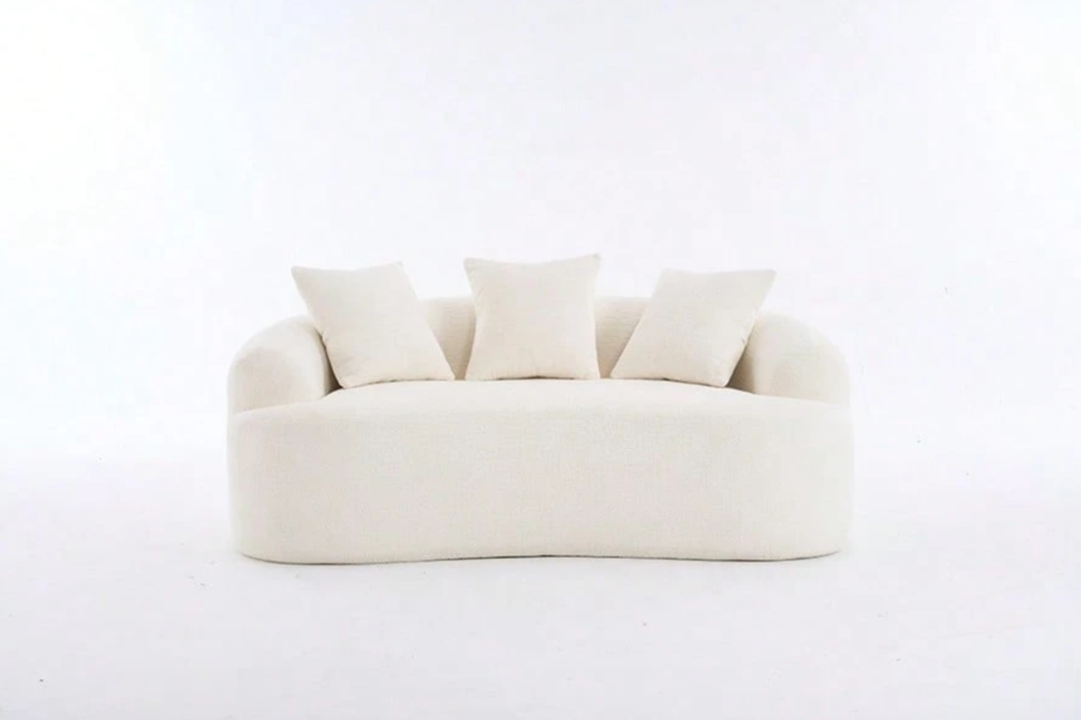 luxury beige couch curved with throw pillows